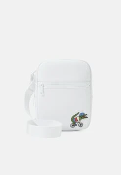 LACOSTE X NETFLIX UNISEX - Umhängetasche - White -Lacoste 224fec1d7c3d40dd9f77ac09dcfe1cf9 1