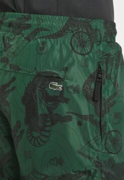 LACOSTE X NETFLIX UNISEX - Jogginghose - Green/black -Lacoste 7a7055b5163045558572f7e030f2c4a9