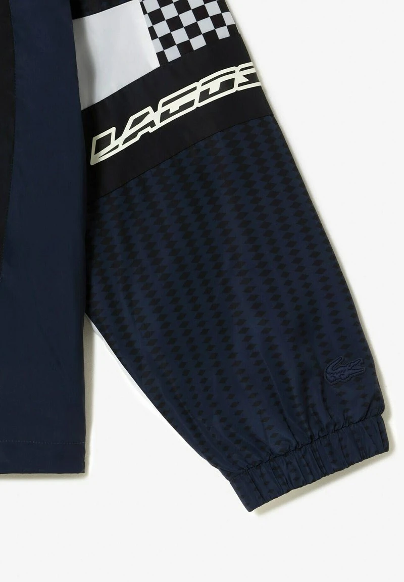 Lacoste Trainingsjacke - Noir Bleu 6 Lacoste Trainingsjacke - Noir Bleu – Bild 4