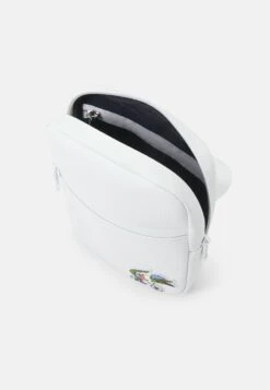 LACOSTE X NETFLIX UNISEX - Umhängetasche - White -Lacoste e93ba7206780442b853acb2c0f4c6960