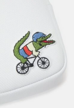 LACOSTE X NETFLIX UNISEX - Umhängetasche - White -Lacoste e9e499cbf6e044b493557033622f85dd